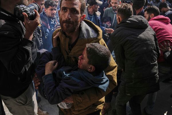 Palestinian children injured in an Israeli airstrike are brought to the Baptist Hospital in Gaza City, Saturday, April 12, 2025. (AP Photo/Jehad Alshrafi)