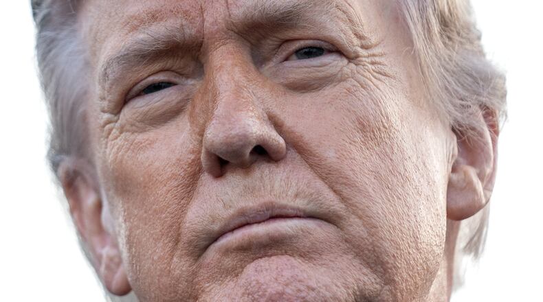 President Donald Trump listens to a reporter's question as he visits the Lincoln Memorial Reflecting Pool to see the new blue protective coating being applied as part of a renovation project, Thursday, May 7, 2026, in Washington. (AP Photo/Mark Schiefelbein)