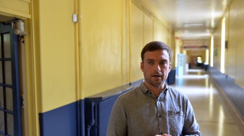WonderRoot executive director Chris Appleton talks about the upcoming renovation work to the John F. Faith Elementary, which opened in 1922. After winning the Atlanta Public Schools board's approval Monday night, WonderRoot will renovate and move into the former school in 2015. KENT D. JOHNSON/KDJOHNSON@AJC.COM