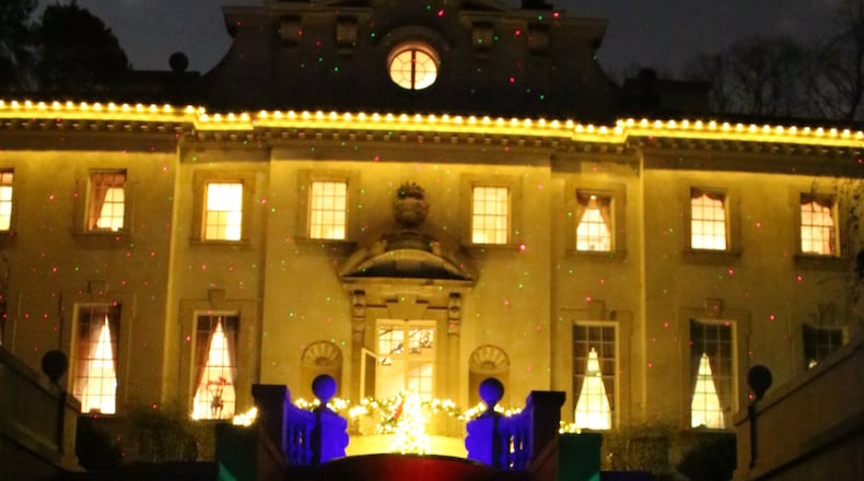 The exterior of Swan House was bathed in holiday colors for Candlelight Nights last year. Courtesy of Atlanta History Center.