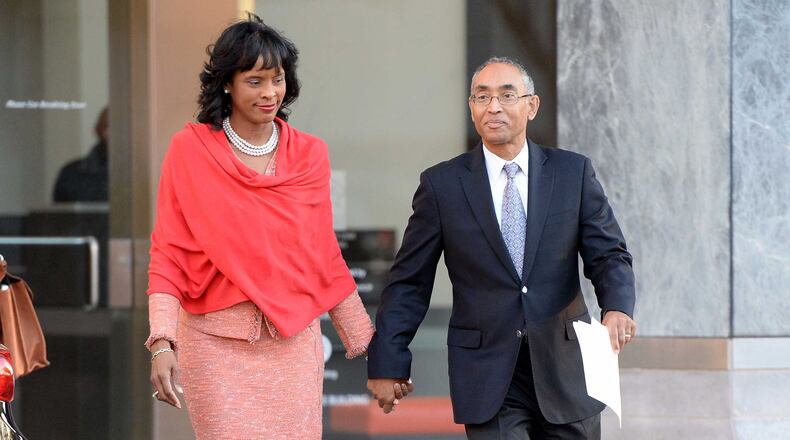 DeKalb CEO Burrell Ellis and his wife, Philippa, head to a press conference Dec. 1 where he spoke for the first time since he was convicted a year and a half ago following a second trial in DeKalb County. The Georgia Supreme Court threw out Ellis’ guilty verdicts on Nov. 30. KENT D. JOHNSON/kdjohnson@ajc.com