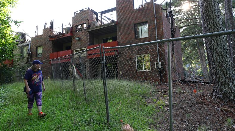 The ruins of a burnt out building at what was then called The Village at Kensington remained standing September 2022, six months after a blaze brought down its roof. The Dekalb County complex has since been renamed Avondale Village and was highlighted in The Atlanta Journal-Constitution's "Dangerous Dwellings" series. The complex is included in the newspaper's online database of apartments with rampant crime, code violations, fires and other hazards that put residents at risk. (Curtis Compton / Curtis.Compton@ajc.com)