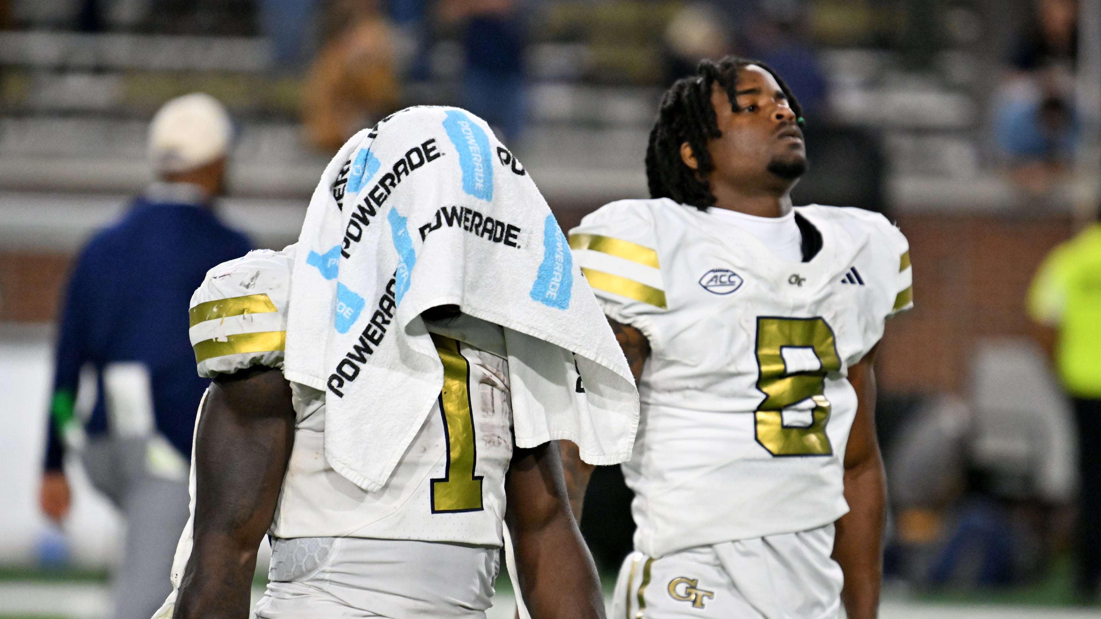 Georgia Tech running back Jamal Haynes (left) and wide receiver Malik Rutherford leave the field after Pittsburgh beat the Yellow Jackets on Saturday at Bobby Dodd Stadium. (Hyosub Shin/AJC)