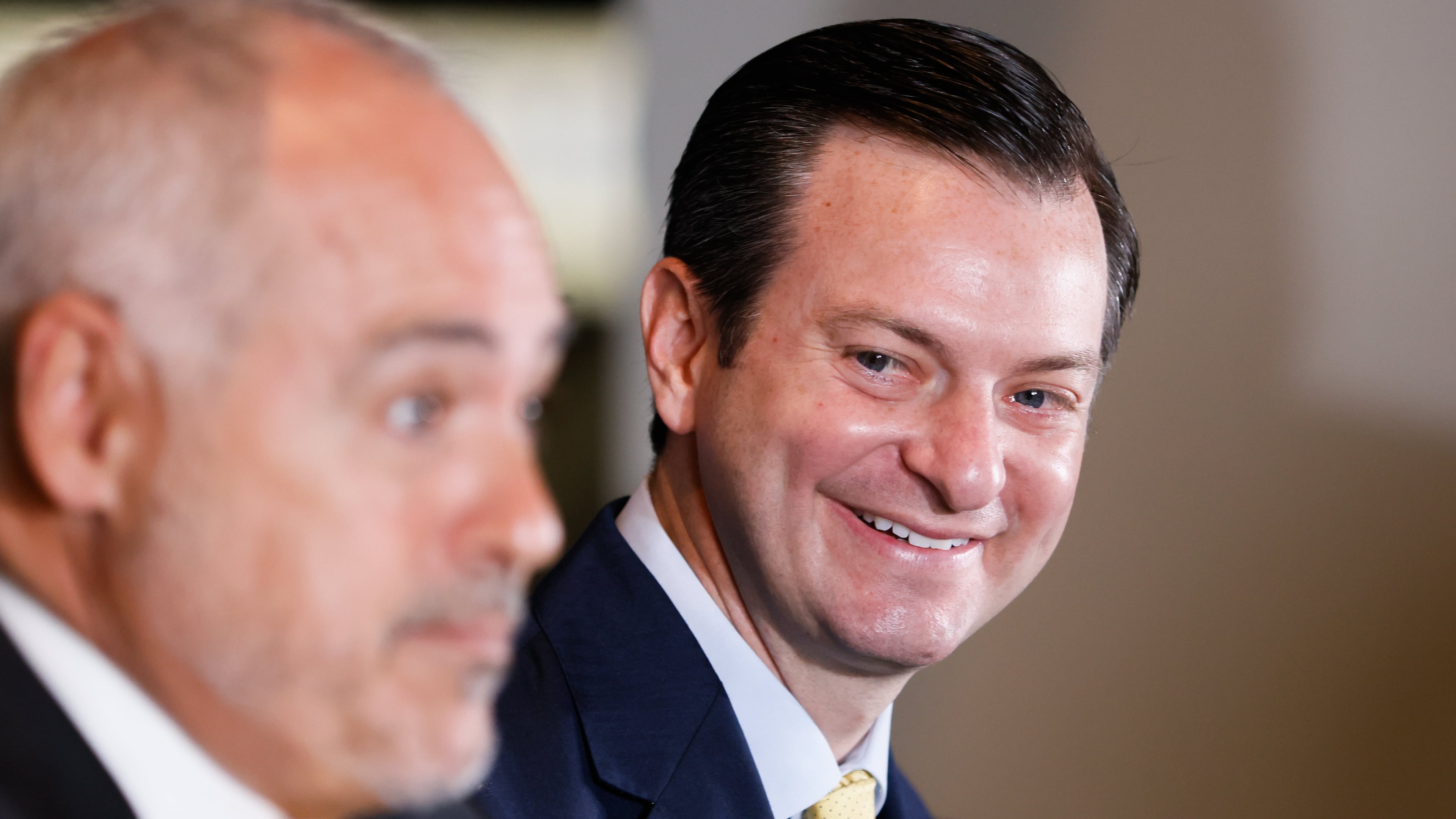 Georgia Tech Vice President and Director of Athletics Ryan Alpert listens to Georgia Tech President Ángel Cabrera during an introductory press conference for Alpert in the Callaway Club at McCamish Pavilion in Atlanta on Wednesday, July 16, 2025. (Abbey Cutrer / AJC)