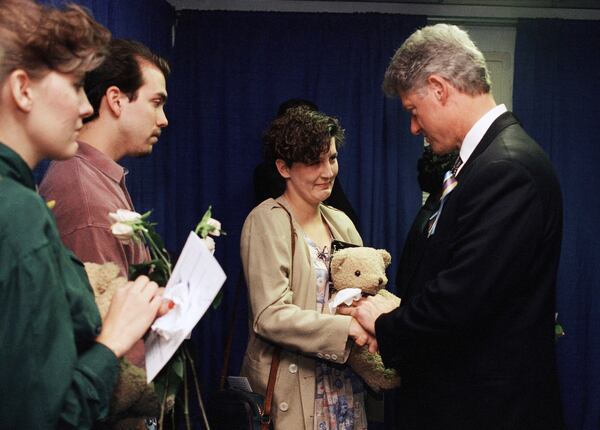FILE - Aren Almon greets President Bill Clinton after a prayer service for the victims of the deadly truck bomb attack in Oklahoma City on April 23, 1995. (AP Photo/Pat Sullivan, File)