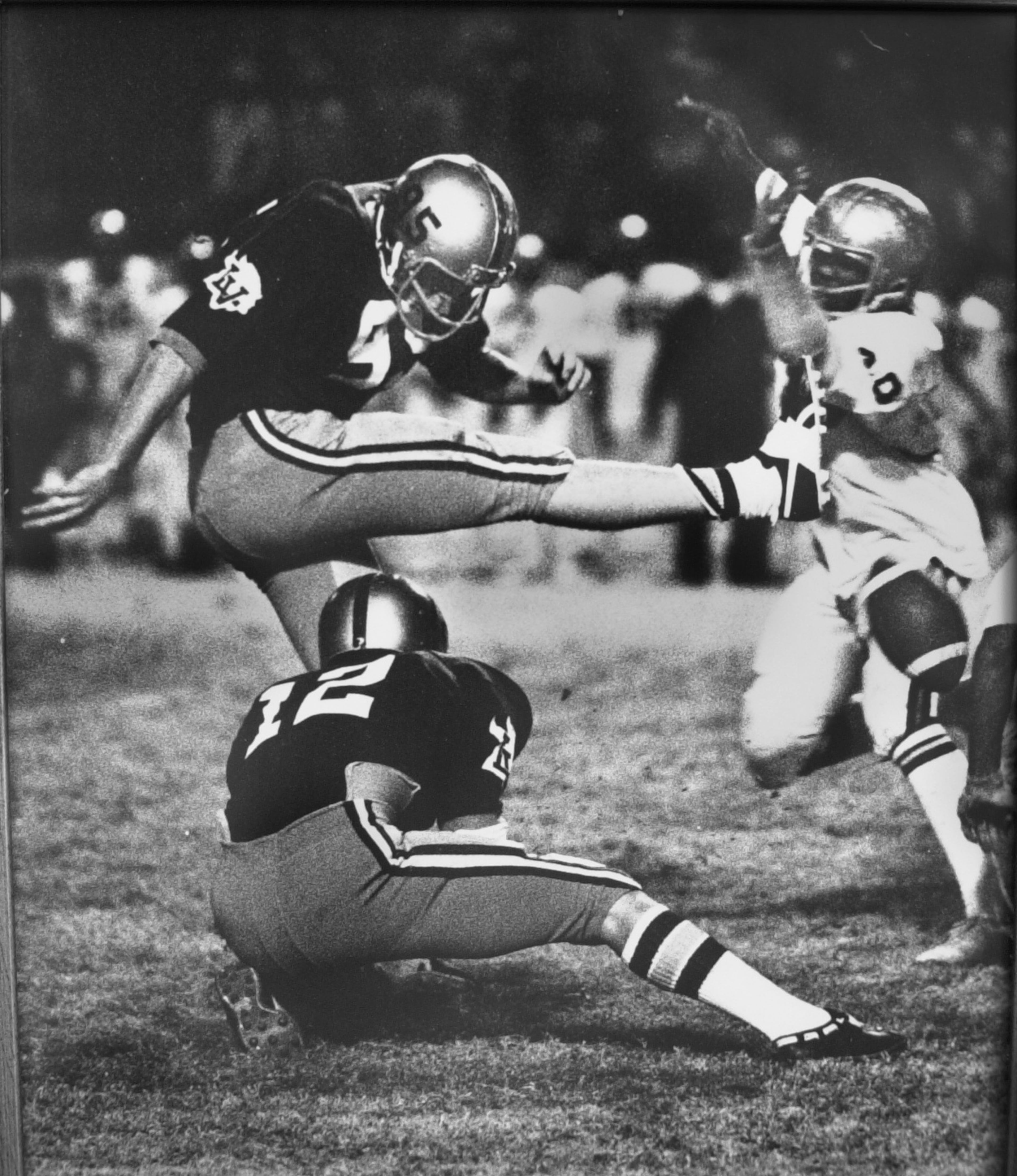 Lakeside High's John Creviston has his kick blocked against Douglass High School in the north Georgia championship game in 1975. His apparent game-winning kick against Douglass (the next play, after a bad call by an official) was overturned and the win taken away after a couple of court hearings.(AJC file)
