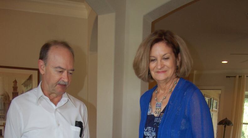 New Austinites Joe and Kathleen Stafford, whose escape from Iran during the hostage crisis was the basis of the movie “Argo,” look over memorabilia from the adventure.
