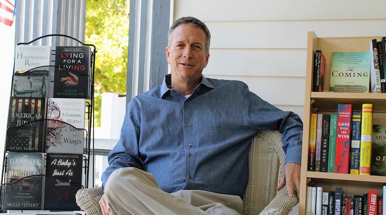 SFK Press co-founder Steve McCondichie is seated in his pop-up bookstore, Southern Fried Books, located on the front porch of his commercial real estate business in Newnan. The store, which he says will operate through Christmas, sells SFK books as well as other Southern titles. CONTRIBUTED