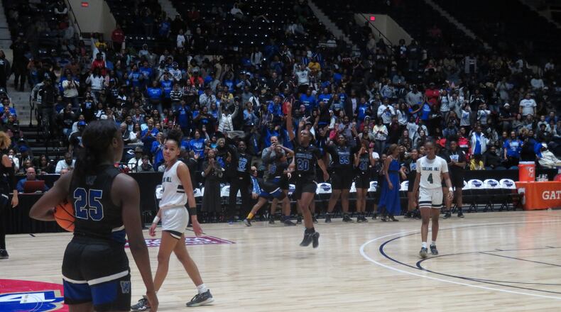 The Westlake Lady Lions begin to celebrate in the waning moments of their Class AAAAAAA championship game against the Collins Hill Lady Eagles on Saturday, March 7, 2020 at the Macon Centreplex. (Adam Krohn for the AJC)