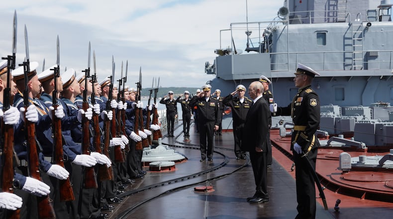 Russian President Vladimir Putin, second right, visits the Varyag missile cruiser of the Pacific Fleet to watch a military exercise near Yuzhno-Sakhalinsk, on Sakhalin Island, Russia, Wednesday, Aug. 12, 2026. (Gavriil Grigorov, Sputnik, Kremlin Pool Photo via AP)