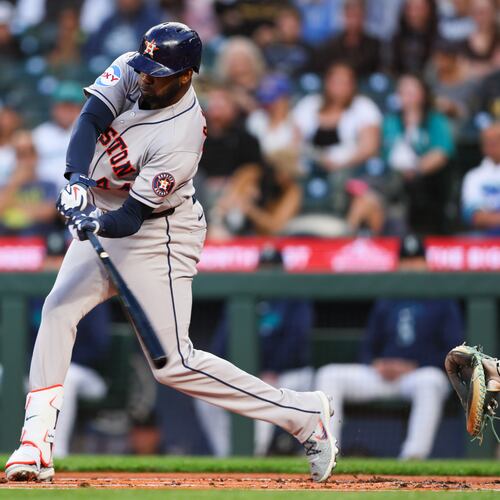 Houston Astros designated hitter Yordan Alvarez (44) hits an RBI single in the first inning of a baseball game against the Seattle Mariners, Tuesday, Sept. 22, 2026, in Seattle. (AP Photo/Kevin Ng)