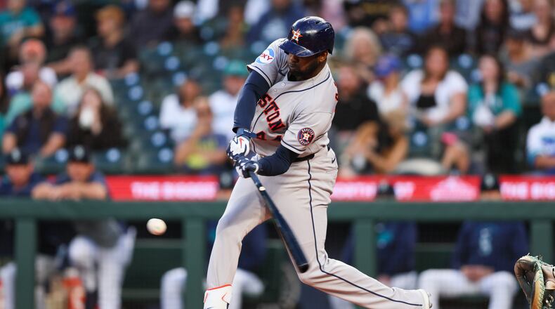 Houston Astros designated hitter Yordan Alvarez (44) hits an RBI single in the first inning of a baseball game against the Seattle Mariners, Tuesday, Sept. 22, 2026, in Seattle. (AP Photo/Kevin Ng)