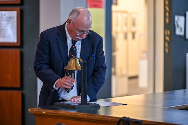 Larry Sprague rings a bell for the Two Bell Ceremony during the Pearl Harbor Remembrance Day event at the National Museum of the Mighty Eighth Air Force near Savannah on Sunday, Dec. 7, 2025. (Sarah Peacock for the AJC)