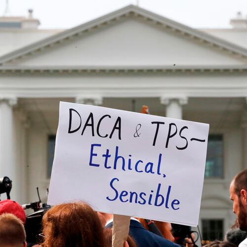 A person holds up a sign in support of the Deferred Action for Childhood Arrivals, known as DACA, and Temporary Protected Status programs during a rally in support of DACA and TPS outside of the White House, in Washington, Sept. 5, 2017. (AP Photo/Jacquelyn Martin, file)