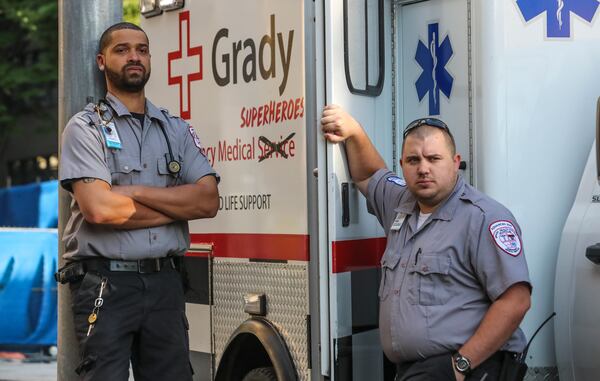 May 19, 2020 Atlanta: Grady EMS paramedic, Reginald McDaniel (left) and advanced EMT, Jerry Payne (right). Commenting on the pandemic, Paramedic, Reginald McDaniel said, "I can't wait until it's over. It's sad to see the people who don't believe that this is going on.The people who are out here doing stuff, street racing and, I don't know, parties. I can't expect people to stay in the house 24-7. I mean, human contact is very important but, I figure people should be smart about what they're doing."  Advanced EMT Jerry Payne said his service during the pandemic has meant, "Be there for each other, help each other out." JOHN SPINK/JSPINK@AJC.COM
