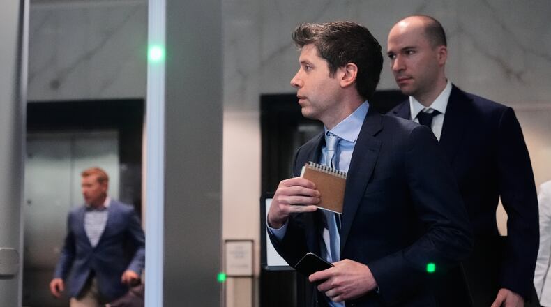 Sam Altman, center, and OpenAI president Greg Brockman, right, arrive at the U.S. District Court in Oakland, Calif., Thursday, April 30, 2026. (AP Photo/Godofredo A. Vásquez)