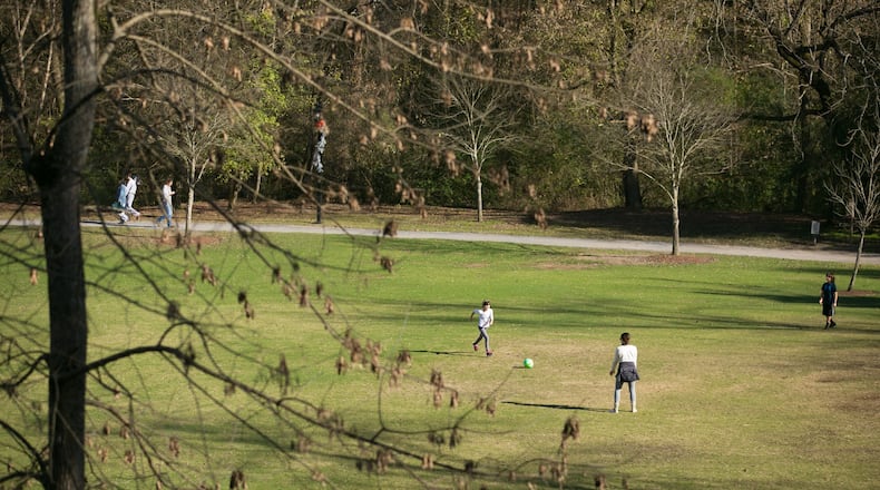 People play in the field at East Cobb Park. The county is seeking citizen input about the parks system master plan.