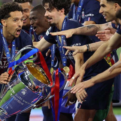 PSG players celebrate with a trophy after the Champions League final soccer match between Paris Saint-Germain and Arsenal in Budapest, Hungary, Saturday, May 30, 2026. AP Photo/Armin Durgut)