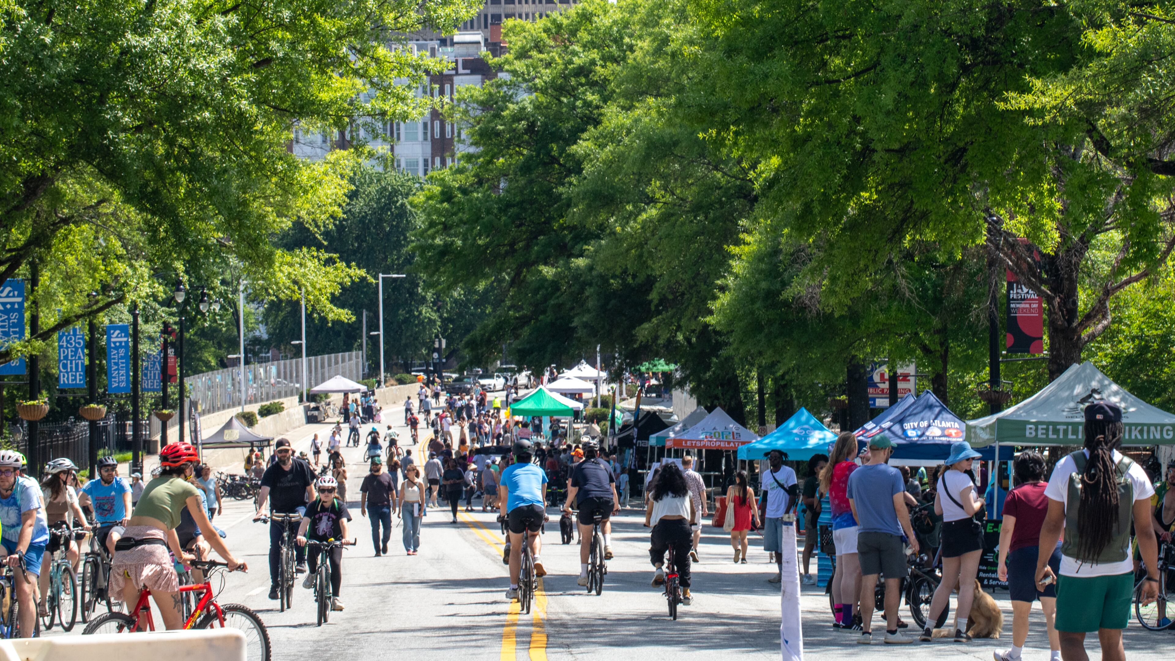 Atlanta Streets Alive shuts down parts of Peachtree Street making way for bikers, walkers, small businesses and city resources on Sunday, April 27, 2025.  (Jenni Girtman for The Atlanta Journal Constitution)