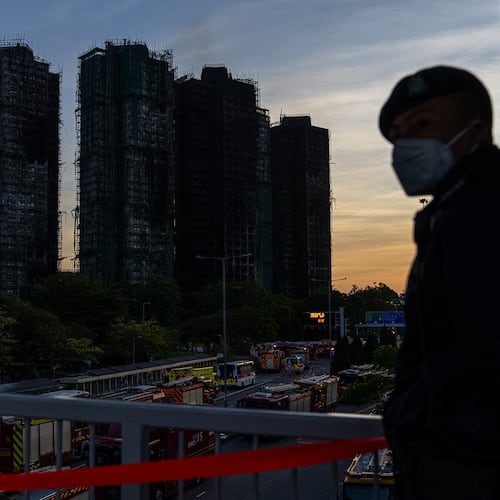 Burned buildings are seen at the scene of the fire at Wang Fuk Court, a residential estate in the Tai Po district of Hong Kong's New Territories, Friday, Nov. 28 2025. (AP Photo/Chan Long Hei)
