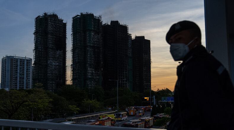 Burned buildings are seen at the scene of the fire at Wang Fuk Court, a residential estate in the Tai Po district of Hong Kong's New Territories, Friday, Nov. 28 2025. (AP Photo/Chan Long Hei)