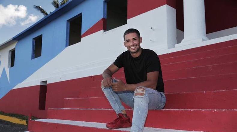 Héctor Collazo Hernández has been painting flags on abandoned buildings, turning them into tourist attractions. Jose A. Iglesias/Miami Herald/TNS