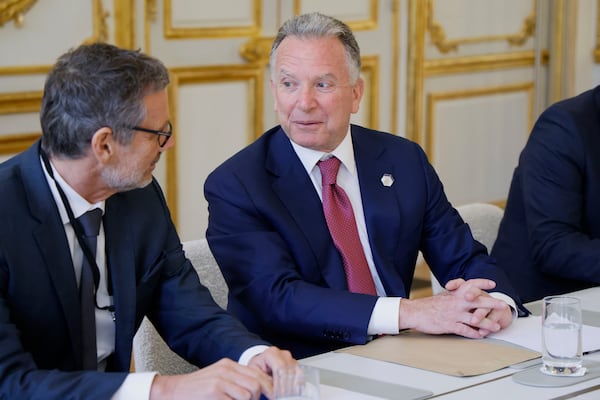 Germany national security advisor Jens Plotner, left, and U.S. Special Envoy Steve Witkoff speak during a meeting at the Elysee Palace in Paris, Thursday, April 17, 2025. (Ludovic Marin, Pool Photo via AP)