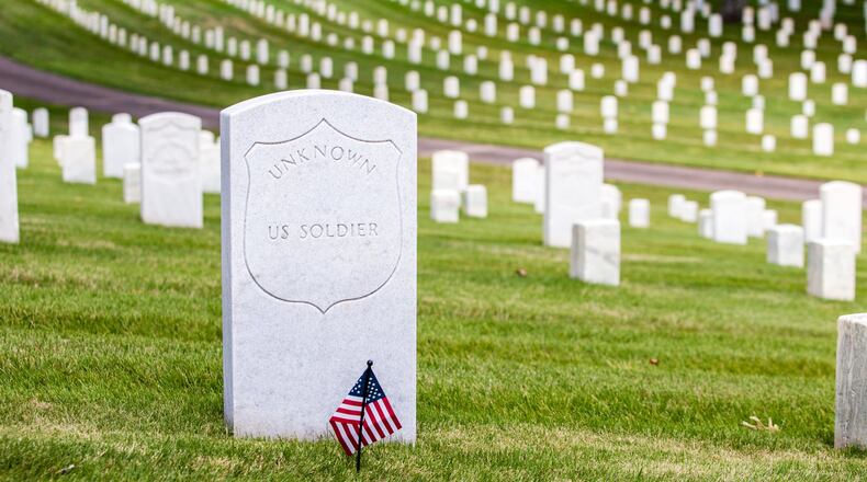 Marietta National Cemetery is without a flag at every headstone Saturday, May 23, 2020. Brad Quinlin, the cemetery’s volunteer historian, said freed slaves placed flower petals on headstones in the cemetery in 1868 to honor the Union soldiers who fought for their freedom, and flags have been placed at each grave site on the grounds since 1869, a Memorial Day or Decoration Day tradition that was put on hiatus this year. (Jenni Girtman for The Atlanta Journal-Constitution)