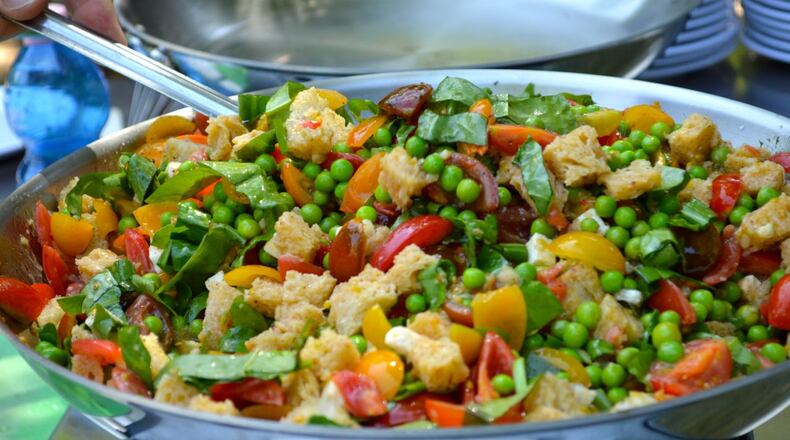 a local warm salad of heirloom tomatoes, peas, bread and sorrel (photo credit Alexa Lampasona)