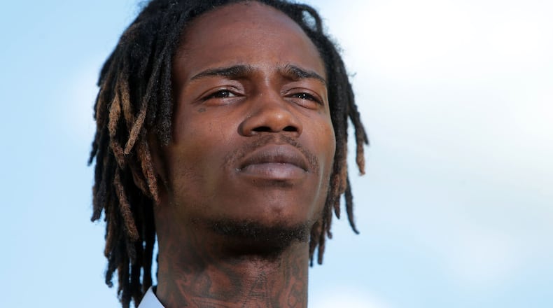 Dorian Johnson tells his version of Michael Brown's death to Al Sharpton on MSNBC on Tuesday, Aug. 12, 2014, at the burned QuikTrip in Ferguson, Mo. Johnson says he was with Michael Brown when a Ferguson officer stopped them and he witnessed Brown's death.  (Laurie Skrivan/St. Louis Post-Dispatch/MCT)