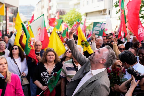 Socialist Party secretary general Pedro Nuno Santos waves to supporters during an election campaign action in Moscavide, on the outskirts of Lisbon, Friday, May 16, 2025, ahead of the May 18 general election. (AP Photo/Armando Franca)