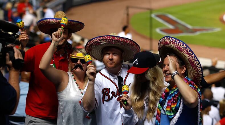 Fans celebrate the Cinco de Mayo holiday during the game between the Phillies and the Braves at Turner Field. (Photo by Mike Zarrilli/Getty Images)