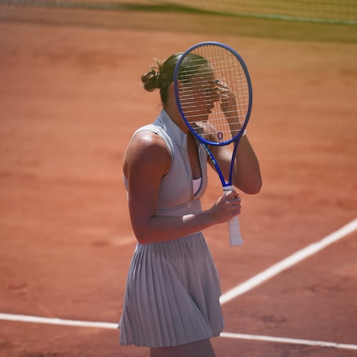 Marta Kostyuk of Ukraine celebrates as she won against Oksana Selekhmeteva of Spain during their first round women's singles tennis match at the French Open tennis tournament in Paris, Sunday, May 24, 2026. (AP Photo/Thibault Camus)