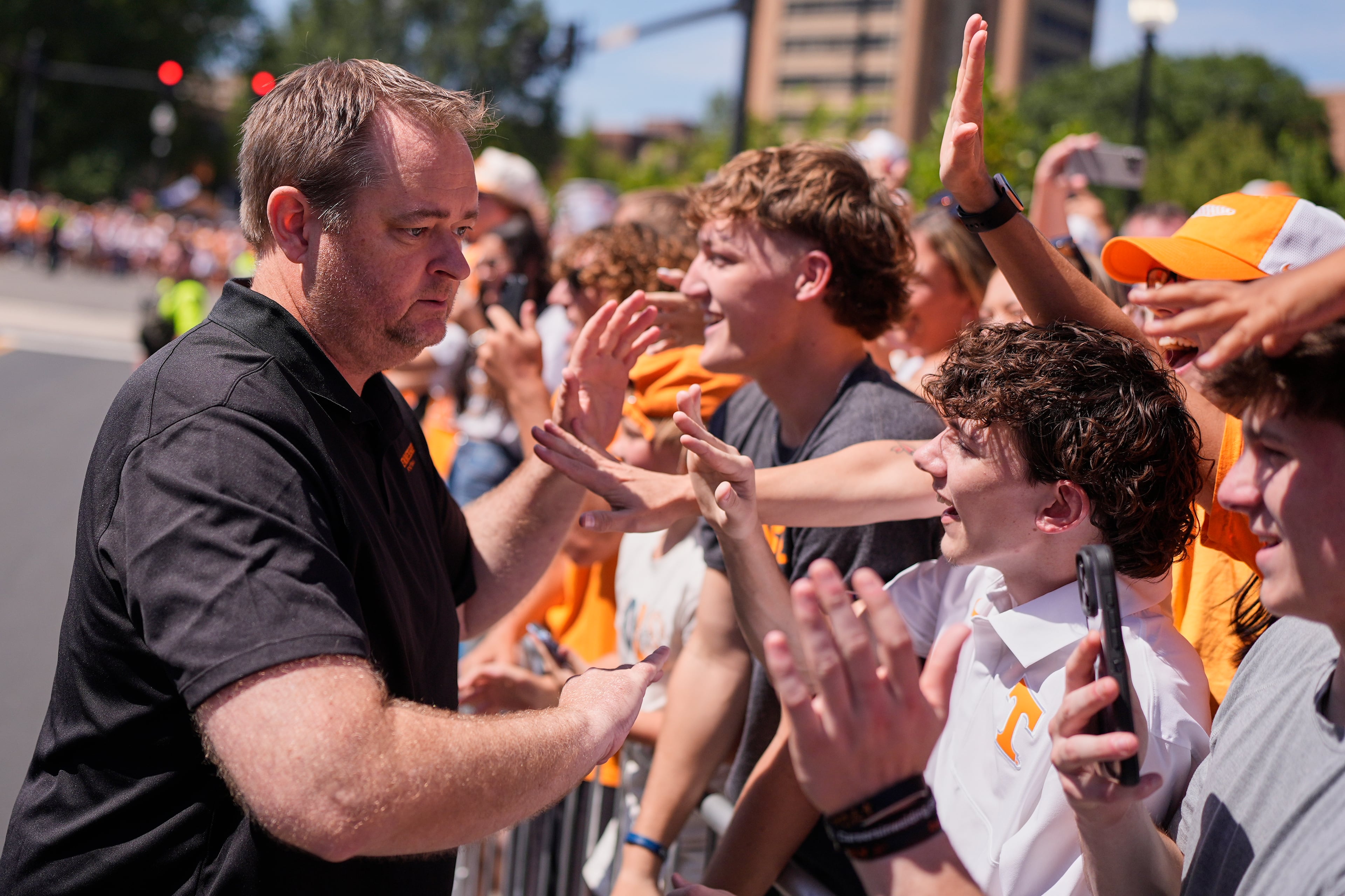 Tennessee coach Josh Heupel greets fans during the team's Vol Walk before Saturday's game at Neyland Stadium in Knoxville. Heupel will try to end the Vols' eight game losing streak against Georgia. (George Walker IV/AP)
