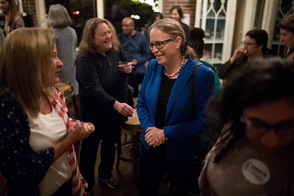 7th Congressional District Candidate Carolyn Bourdeaux speaks to a supporter during an election night party in Norcross on Nov. 6, 2018.  Branden Camp/Special