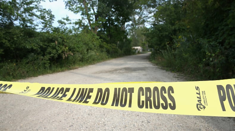 FOX LAKE, IL - SEPTEMBER 02: Crime scene tape is stretched across the entrance to the defunct cement plant where Lt. Joe Gliniewicz was killed on September 2, 2015 in Fox Lake, Illinois. Gliniewicz, a Fox Lake police officer, was shot and killed yesterday during a foot chase with three suspects. (Photo by Scott Olson/Getty Images)