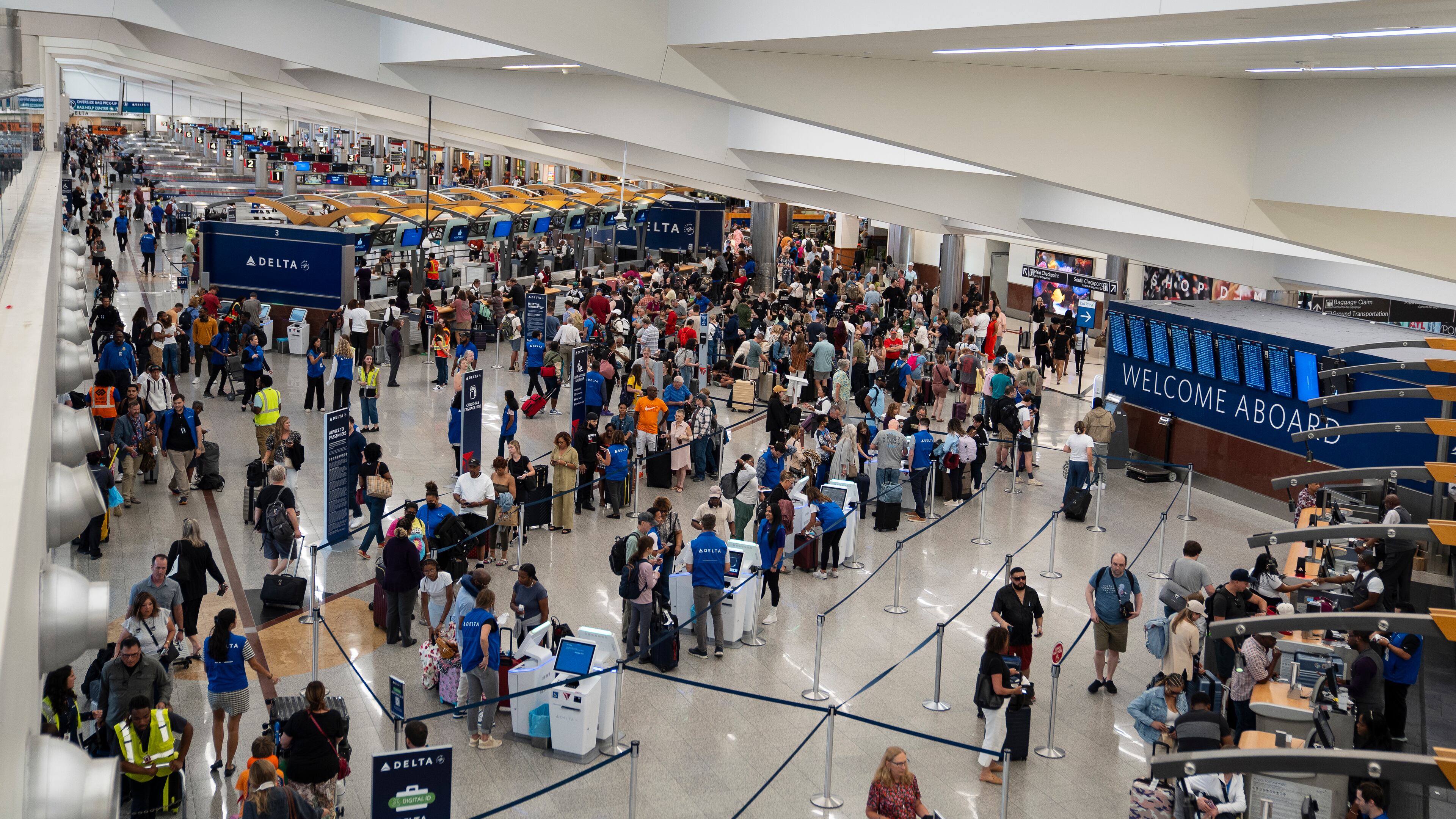 Delta passengers wait to check in following a technology outage that led to delays at Hartsfield-Jackson Atlanta International Airport, on Friday, July 19, 2024. (Nicole Craine/The New York Times)