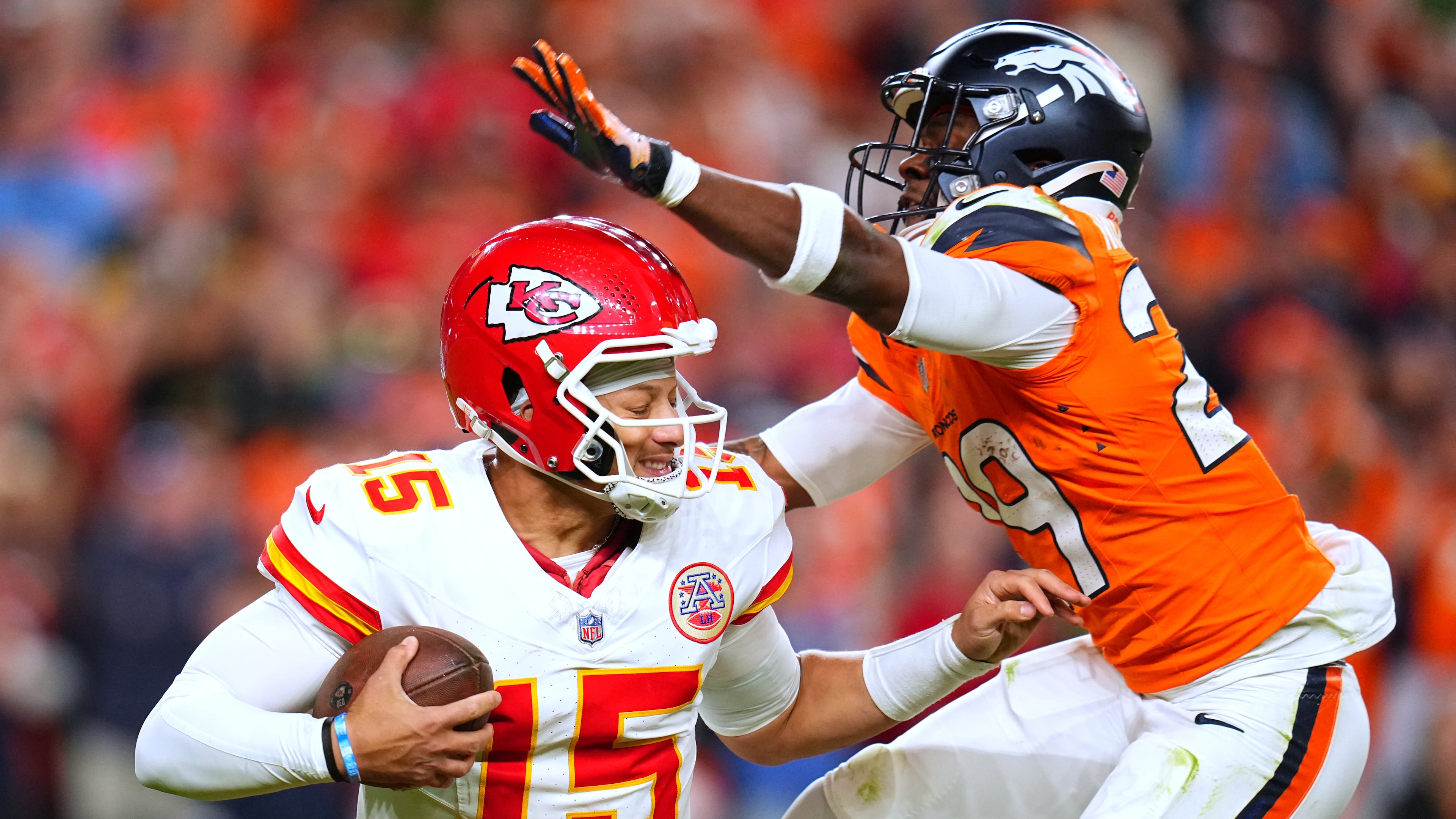 Denver Broncos cornerback Ja'Quan McMillian, right, sacks Kansas City Chiefs quarterback Patrick Mahomes (15) during the second half an NFL football game Sunday, Nov. 16, 2025, in Denver. (AP Photo/Jack Dempsey)