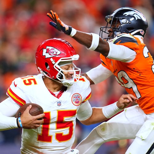 Denver Broncos cornerback Ja'Quan McMillian, right, sacks Kansas City Chiefs quarterback Patrick Mahomes (15) during the second half an NFL football game Sunday, Nov. 16, 2025, in Denver. (AP Photo/Jack Dempsey)