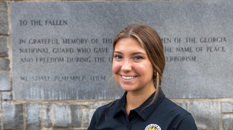 Leighanne Bryant at the Memorial Wall at Clay National Guard Base in Marietta. PHIL SKINNER FOR THE ATLANTA JOURNAL-CONSTITUTION