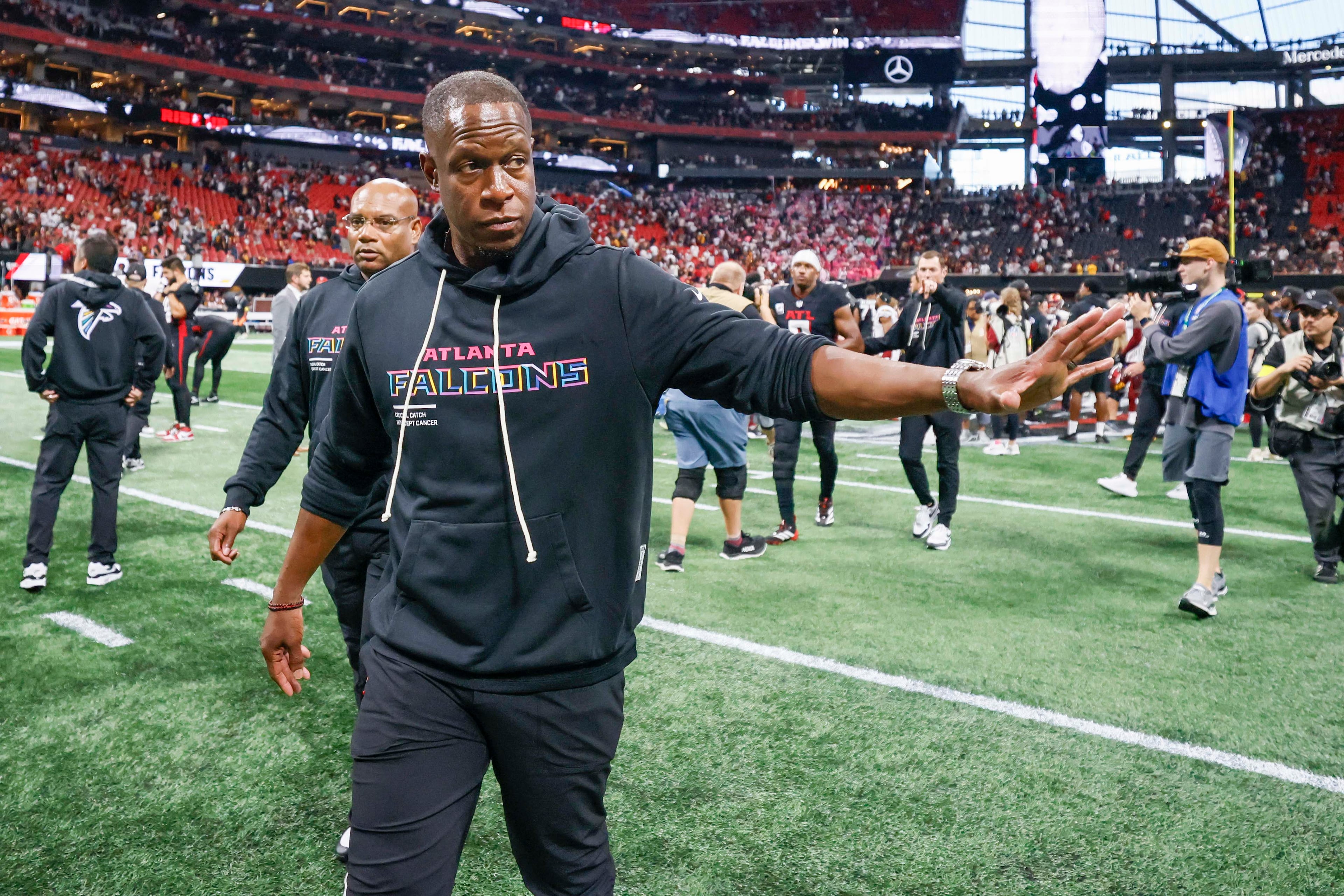 Atlanta Falcons head coach Raheem Morris waves to fans as he walks off the field after the Falcons beat the Washington Commanders 34-27 at Mercedes-Benz Stadium in Atlanta on Sunday, September 28, 2025. (Miguel Martinez/AJC)