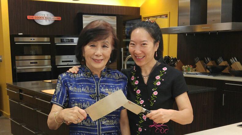 Natalie Keng (right) teaches a cooking class with her mother, Margaret Keng. In addition to the classes, Natalie Keng’s business, Chinese Southern Belle, offers chef demos, and sells prepared sauces and Asian kitchenware. Courtesy of Natalie Keng.