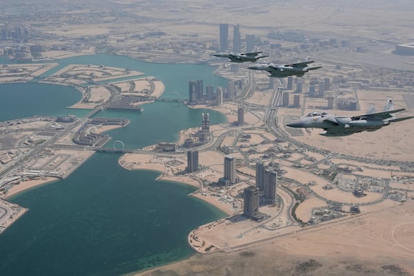 Qatar Emiri Air Force F-15s provide an honorary escort for Air Force One, carrying President Donald Trump, as it arrives in Doha, Qatar, Wednesday, May 14, 2025. (AP Photo/Alex Brandon)