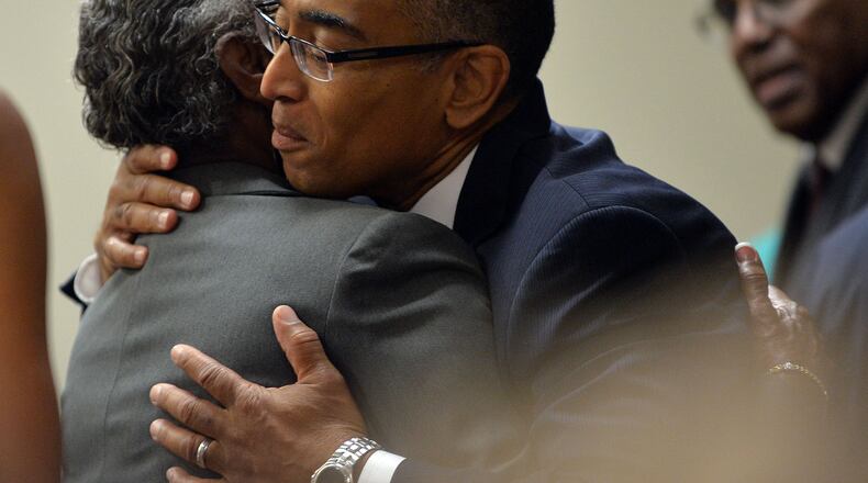 Suspended Dekalb County CEO Burrell Ellis hugs a supporter before he appears before Judge Courtney L. Johnson in Dekalb County Superior Court during opening arguments in his trial Tuesday, September 16, 2014.