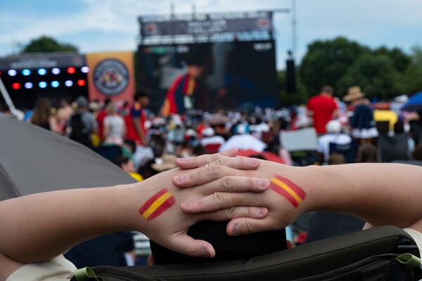 A Spain fan watchs the World Cup finals in Piedmont Park on Sunday, July 19, 2026. (Ben Gray for the AJC)