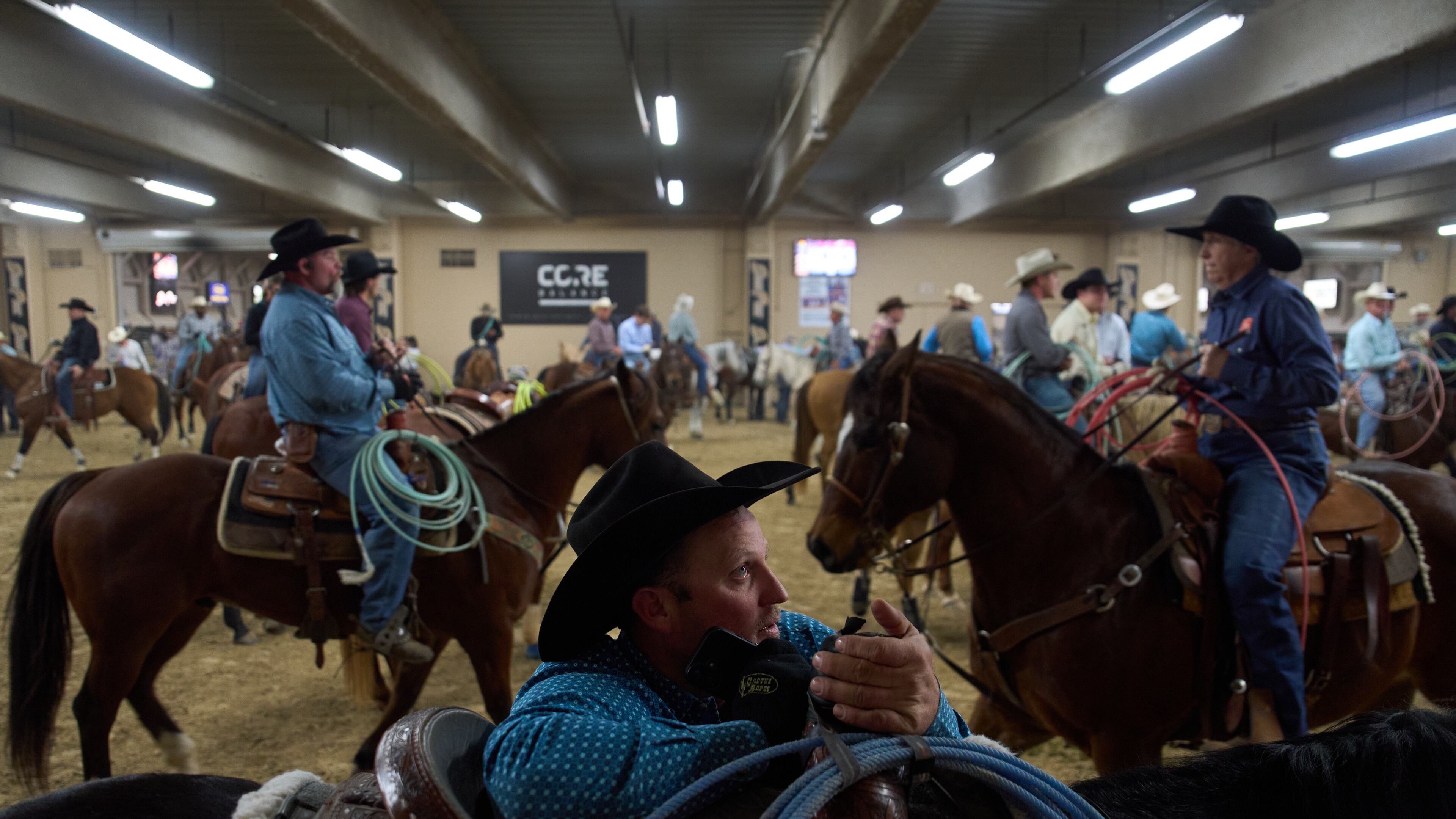 Contestants wait to compete during the World Series of Team Roping at the South Point hotel-casino in Las Vegas Tuesday, Dec. 9, 2025, in Las Vegas. (AP Photo/John Locher)