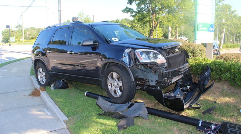 A motorcyclist died in a crash after running a red light and colliding with this SUV on Thursday morning, police said.