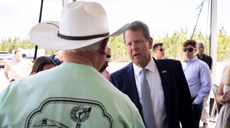 Gov. Brian Kemp begins a southeast Georgia swing Monday that features a stop in the Savannah area to celebrate the groundbreaking of Hyundai Motogroup’s $5.5 billion “Metaplant America,” the largest economic development project in state history. He is pictured greeting people before announcing in May that the South Korean automotive giant would be building an electric vehicle plant in Ellabell, Ga. (Stephen B. Morton/AJC)