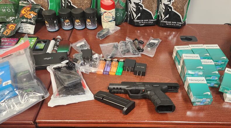 Marcking Guensley Louis and Jeremiah Tyson were arrested Monday while they were attempting to get drugs and contraband into the DeKalb County Jail, officials said.