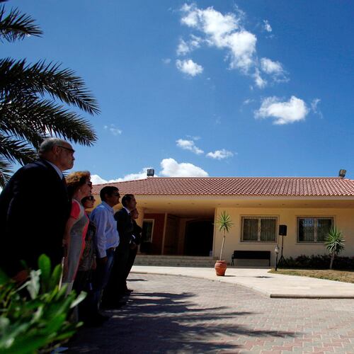 FILE - U.S. Ambassador to Libya Gene A. Cretz, right, stands at the podium during a flag raising ceremony for the U.S. Embassy in Tripoli, Libya, Sept. 22, 2011. (AP Photo Abdel Magid al-Fargany, File)